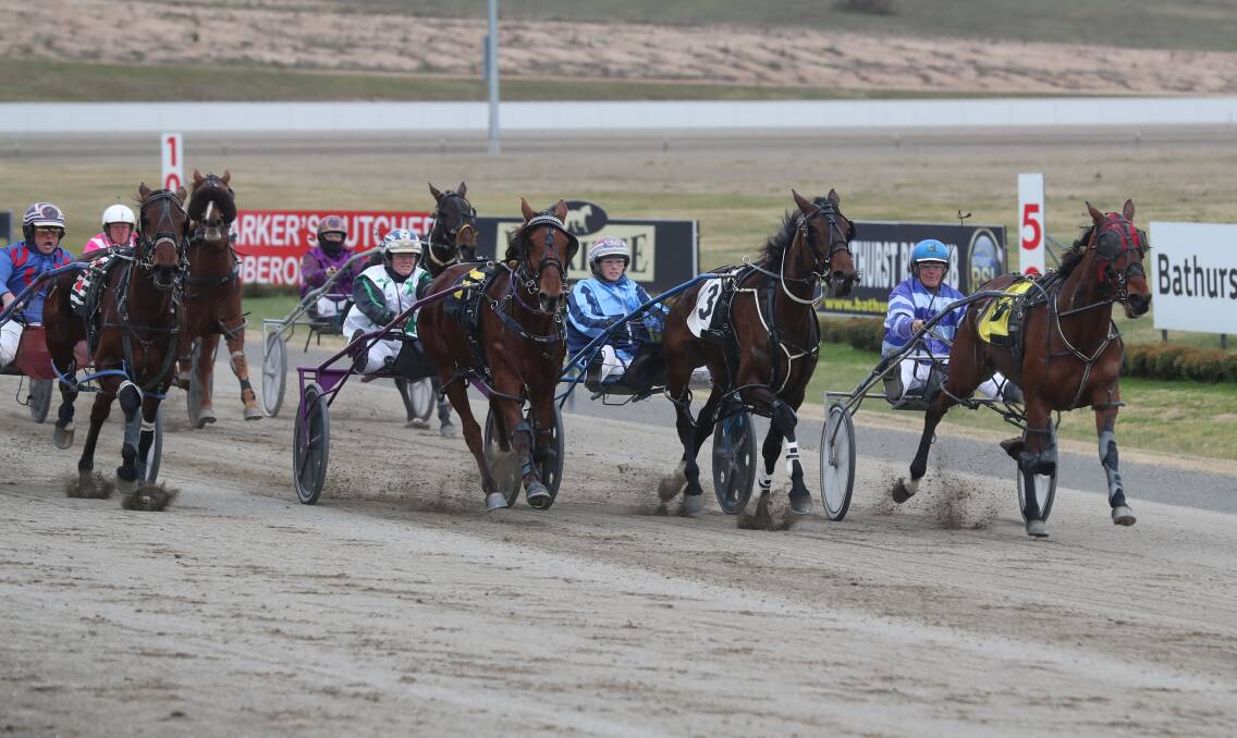 ON THE CHARGE: Graham Betts guides Cee Cee Norman to the lead down the inside of the track. Photo: PHIL BLATCH 071019pbtrots1
