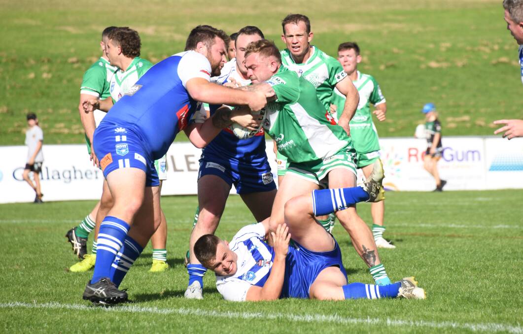 The Bathurst St Pat's defence works to bring down Jyie Chapman during last season's clash with Dubbo CYMS. Picture by Amy McIntyre