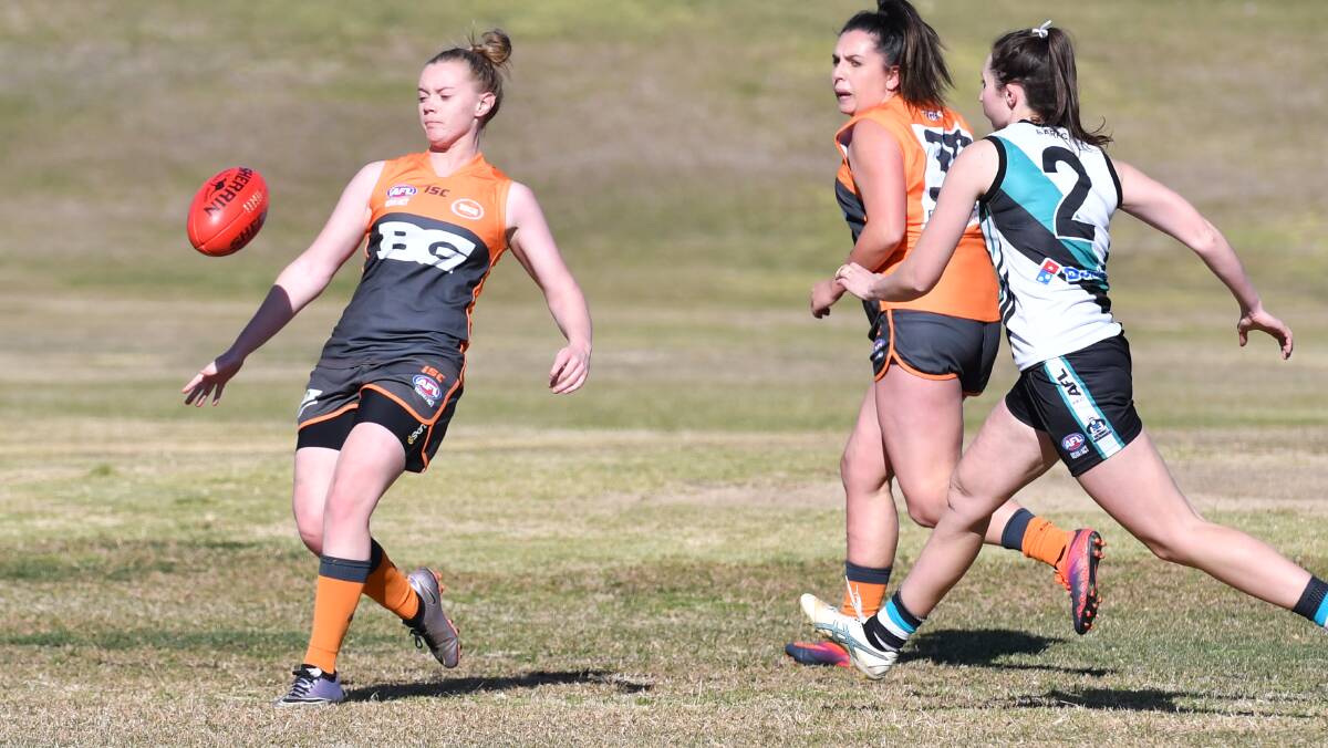 LOVING IT: Brooke Alexander has not regretted her decision to play Australian rules with the Bathurst Giants this season. Photo: ALEXANDER GRANT