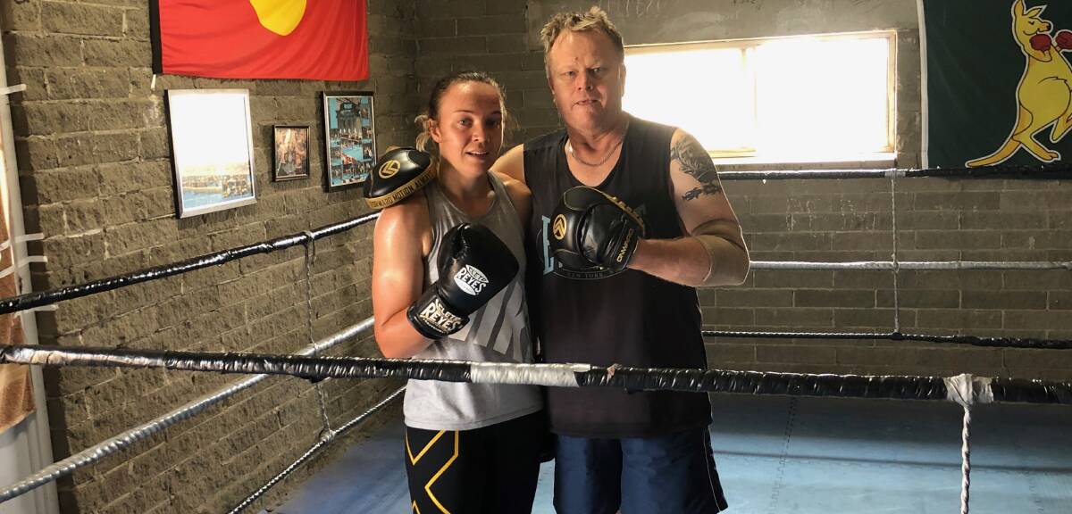 Enja Prest, supported by her coach David Syphers, won an Aussie title at the weekend's Australian Amateur Boxing Championships. Photo: supplied 
