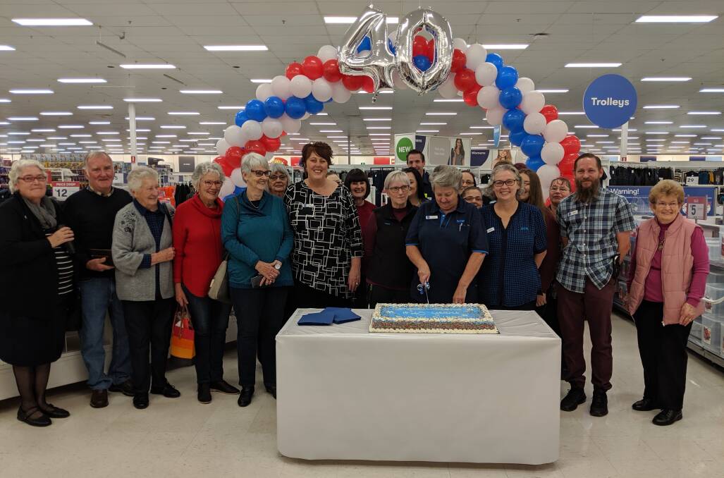 LOOKING BACK: Former Big W team members. celebrate the store's 40th birthday with current team members and customers. Photo: CONTRIBUTED