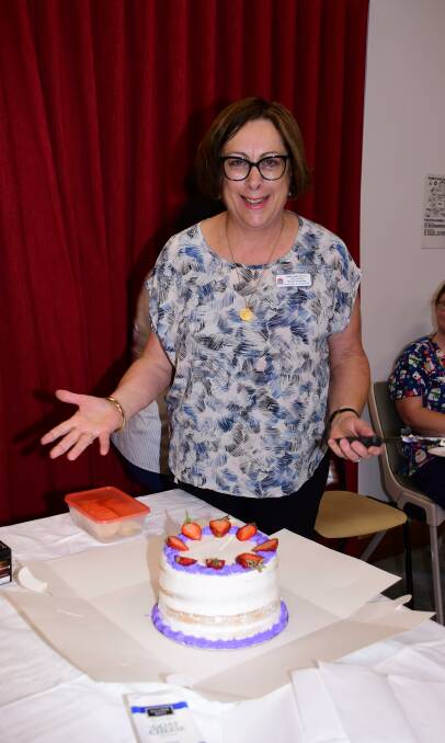 END OF AN ERA: Dubbo Hospital's nursing director Jenny Johnson prepares to cut the cake at her recent farewell afternoon tea. Photo: AMY McINTYRE