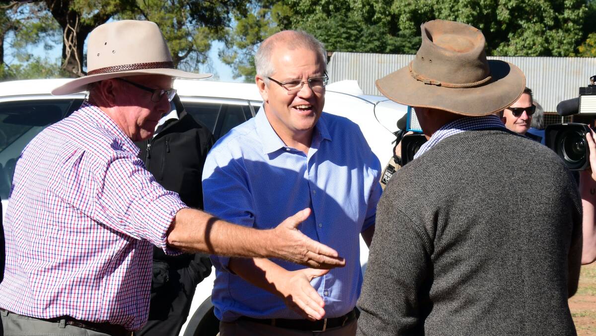 MEETING LOCALS: Nationals MP for Parkes Mark Coulton introduces Prime Minister Scott Morrison to local farmer Kevin West. Photo: BELINDA SOOLE