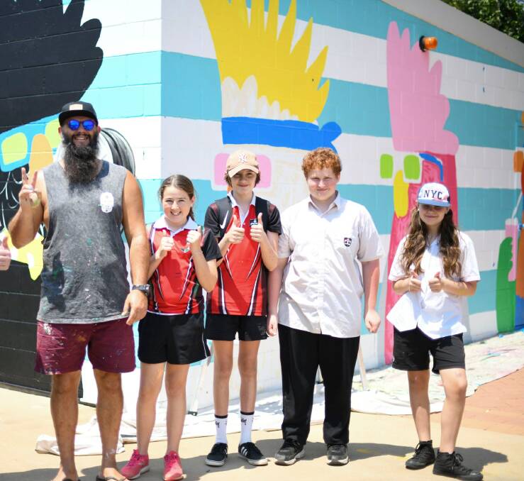 YOUTH ENGAGED: Mulga, Hannah Austin, Nate Markcrow,Cameron Blackman and Azariah Iffland in front of the new mural, which depicts five cool birds. Photo: SUPPLIED