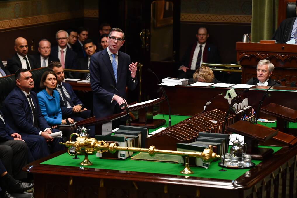 IN PARLIAMENT: NSW Treasurer Dominic Perrottet hands down the state budget. Photo: DEAN LEWINS AAP