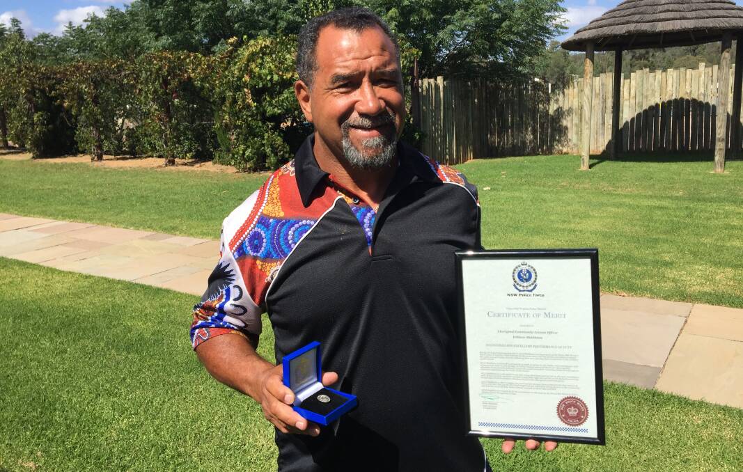COMMITMENT RECOGNISED: Aboriginal community liasion officer Willy Middleton with the certificate and medal he received from the Orana Mid-Western Police District.