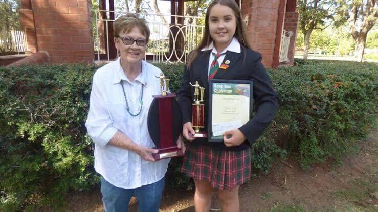 HIGH ACHIEVER: Maree Pobje with an award she received from former local MP Troy Grant. Photo: SUPPLIED