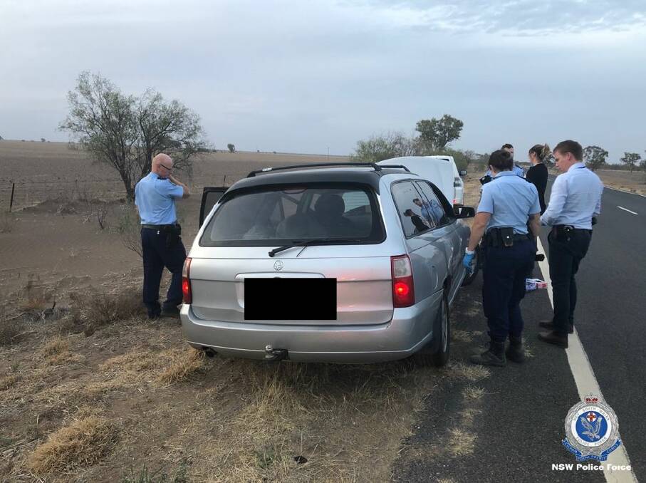 DRUG BUST: Police search a vehicle near Walgett. Photo: NSW POLICE
