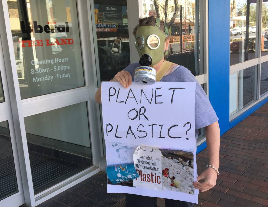 MASKED PROTESTER: Sue Pringle walked around Dubbo with the gas mask on. 