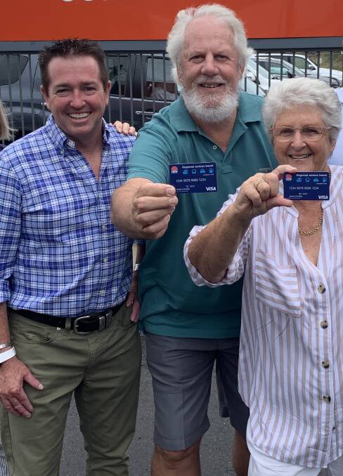 EXCITED SENIORS: Regional Transport Minister Paul Toole with Regional Seniors Travel card pilot participants Rod and Bronwyn Mackenzie. Photo: CONTRIBUTED