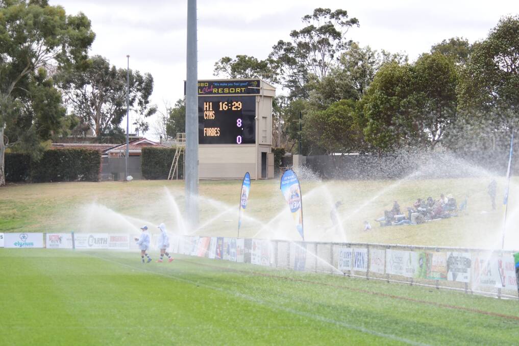 WATER SPECTACLE: Sprinklers on at Apex Oval during the grand final on Sunday. Photo: BELINDA SOOLE