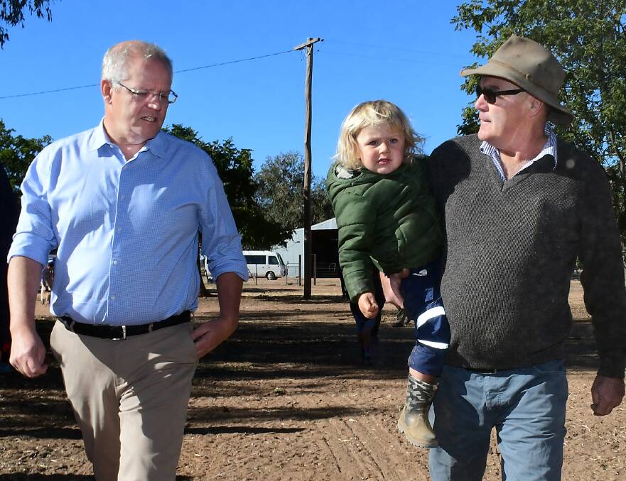 VISITING AGAIN: Prime Minister Scott Morrison met with Darcy Josephs and his pop Kevin West (right) at the family's farm near Dubbo in April. Photo: BELINDA SOOLE