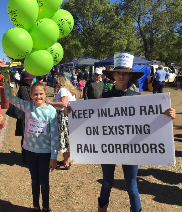 KIDS PROTESTING: Erin Campion and Eva Marchant were hard to miss at the Gilgandra Show. 