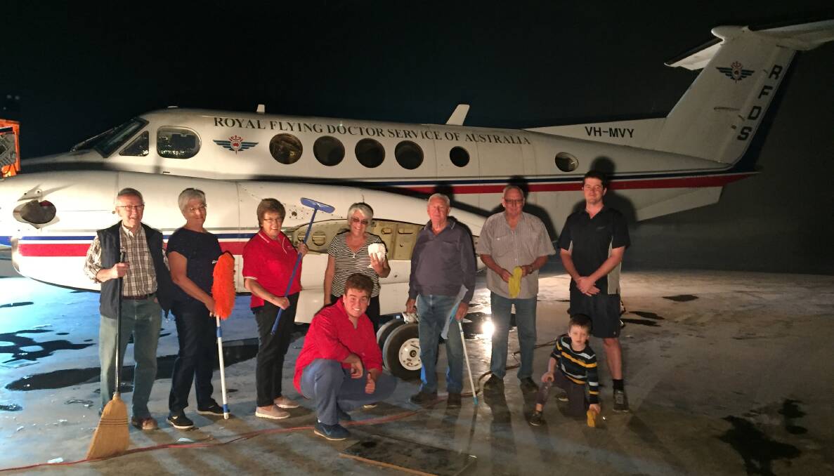 HARD WORKERS: Find out why these RFDS Flying Doctor support group members washed a decomissioned plane on Sunday.