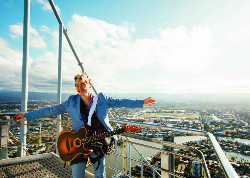 SOARING HIGH: Alex The Astronaut performing on top of Australia's tallest building, SkyPoint, on the Gold Coast. Picture: Mitch Fresta