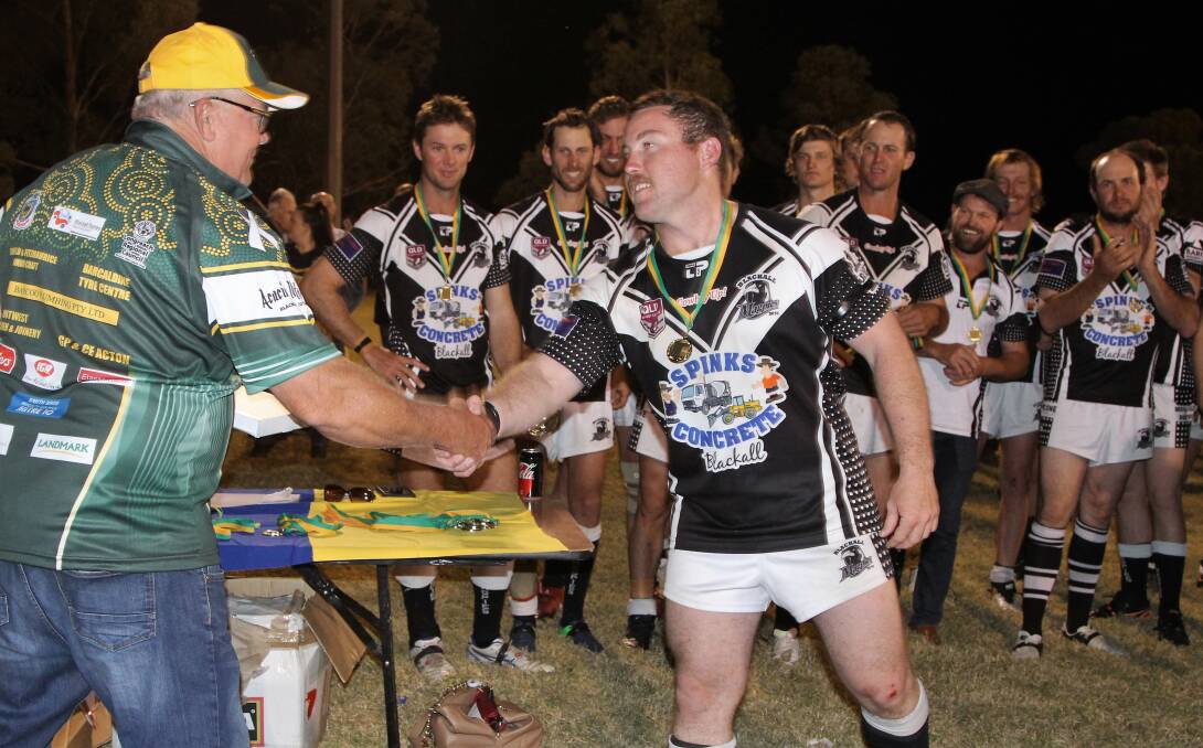 DEDICATION: After travelling between 1300-1650km for every game, Alex Choyce was delighted to receive his winner's medal after Blackall won its first premiership in 30 years. Picture: Sally Cripps