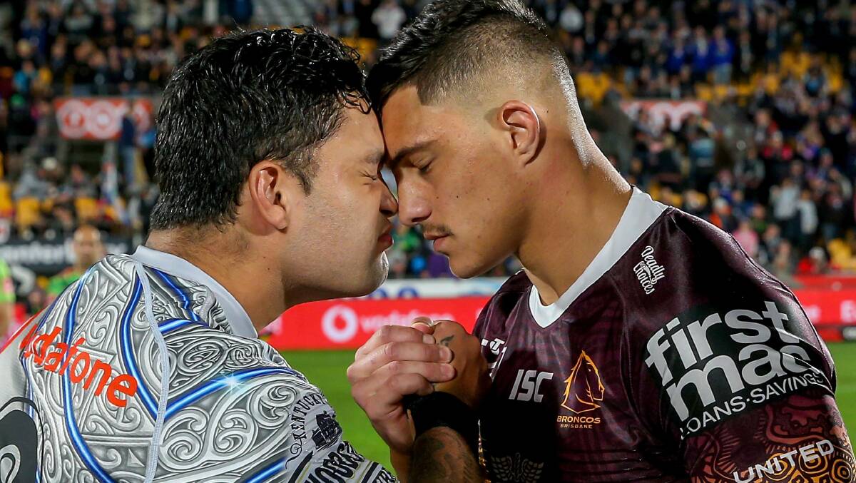 EMOTIONAL: Issac Luke and Kotoni Staggs exchange a hongi, a traditional greeting before the Indigenous Round 11. Staggs will make his international debut with Tonga on Saturday night. Photo: AAP