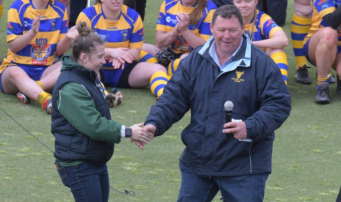 CHANGE: Central west Rugby Union CEO Matt Tink, pictured on grand final day presenting Nikki D'Aquino with her women's player of the year award. Photo: JUDE KEOGH