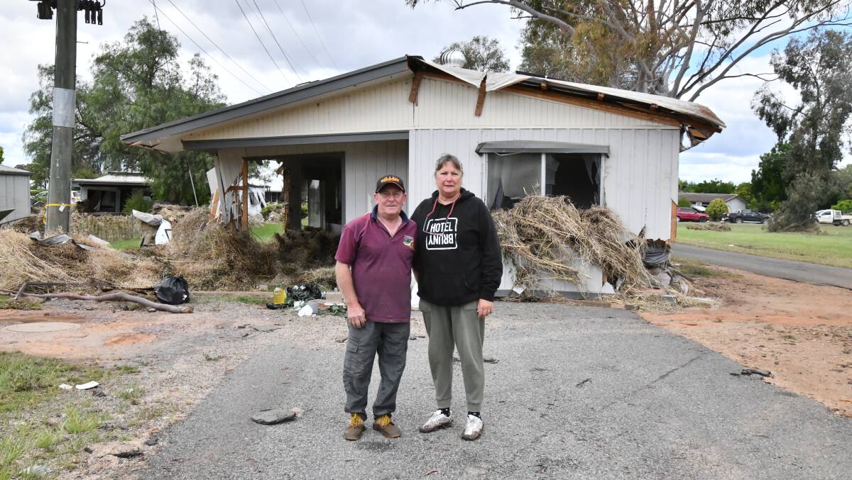 George and Sue Cross standing in front of house that floated down street to where it is and nearly hit them. Picture by Carla Freedman.