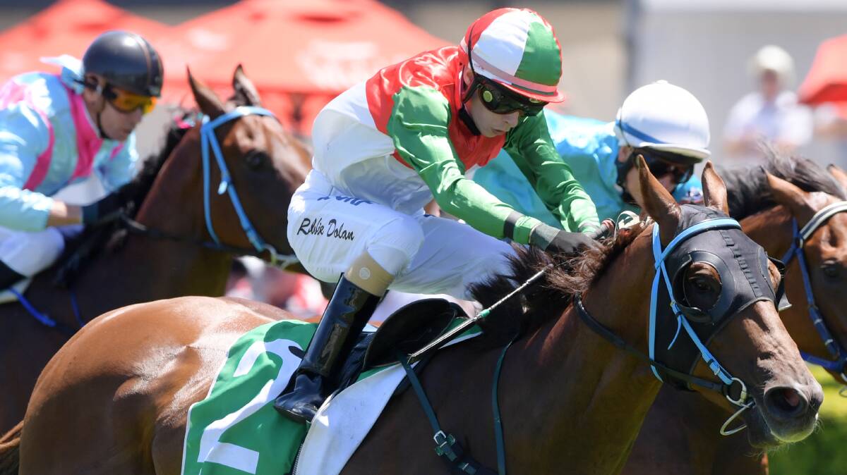ON FIRE: Robbie Dolan rides Cameron Crockett's Ori On Fire to a highway win at Randwick. Photo: AAP