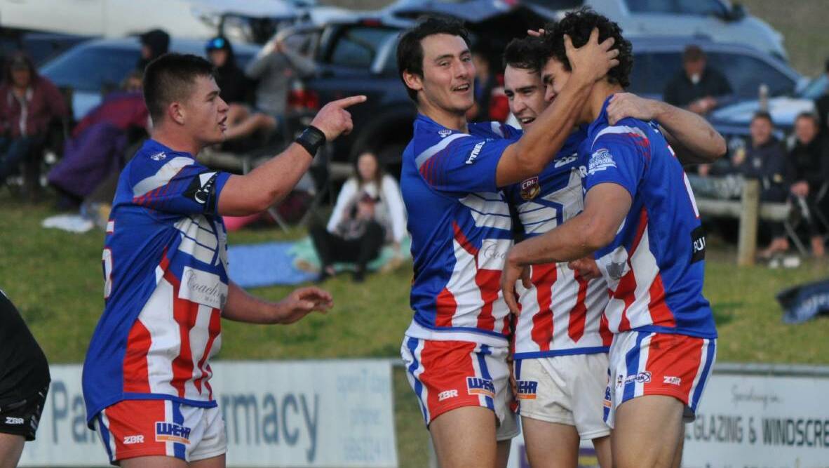 MOBBED: Jacob Smede is mobbed by Parkes teammates during the annual June long weekend derby with Forbes.