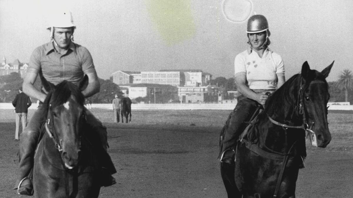 TOGETHER: Cheryl Brown works with leading horsebreaker Max Crockett at Randwick race course in 1975. Photo: AAP