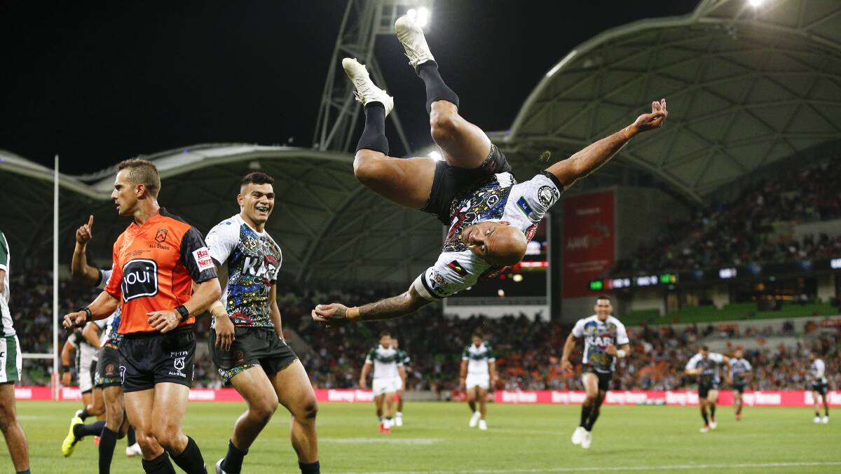 FLYING HIGH: Blake Ferguson scored a try and busted out a back-flip as the Indigenous All Stars racked up a big win on Friday. Photo: AAP