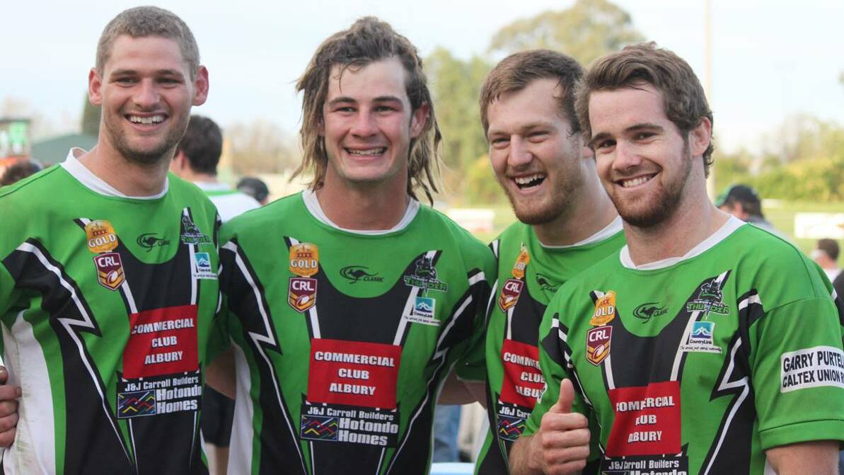 GROUP NINE WIN: Red Bend graduates Jake Grace, Andrew Cowhan, Mitch Davis and Lou Goodwin ­celebrate a Group Nine premiership win.