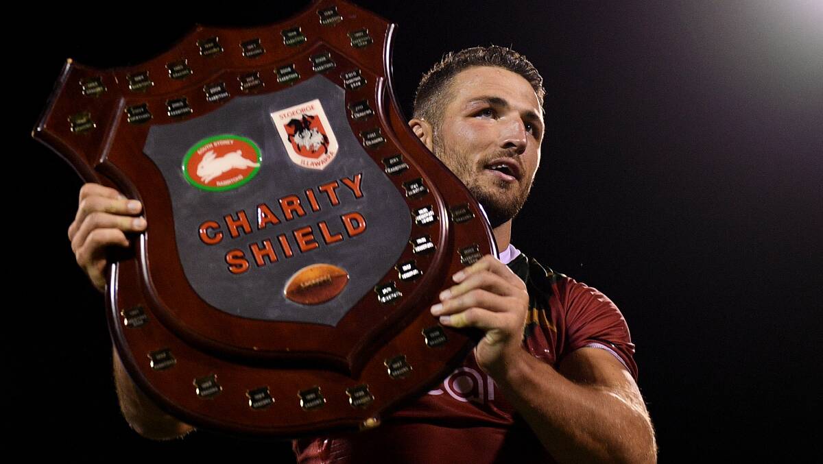 VICTORY: Rabbitohs skipper Sam Burgess with the Charity Shield. Photo: AAP