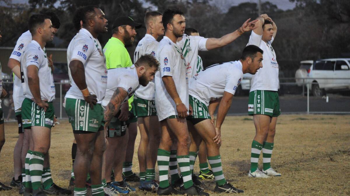 UNFAMILIAR SIGHT: Dubbo CYMS look on as Wellington celebrates a fifth try on Saturday. Photo: NICK McGRATH
