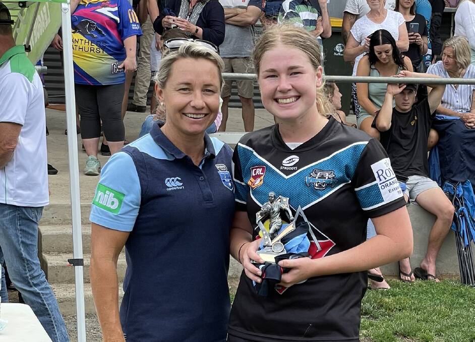BLUE TO THE BONE: NSW Origin player Kylie Hilder and Vipers under 18s gun Lilly Baker, pictured after being awarded player of the grand final on Sunday. Photo: JAKE HUMPHREYS