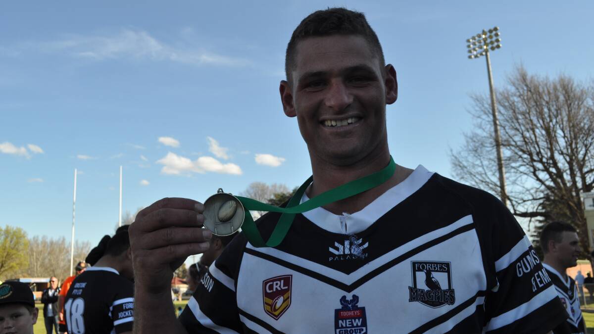 ALL SMILES: Forbes Magpies gun Jake Grace with the Western Premiers Challenge man of the match medal. Photo: NICK McGRATH