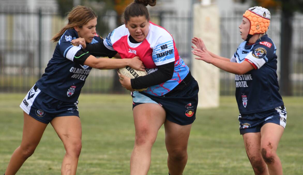 THREE TO WATCH: From left, Hawk Ella-J Harris, Wellington's Rhianna Sutherland and two blues speedster Lailee Phillips took to tackle rugby league well. Photo: BELINDA SOOLE