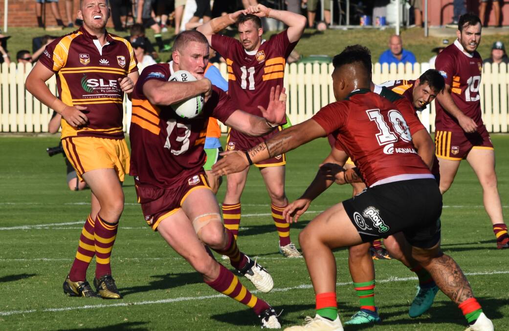IN THE THICK OF IT: South City gun Nick Skinner up against Souths during Saturday's trial match at Albury. Photo: DAILY ADVERTISER
