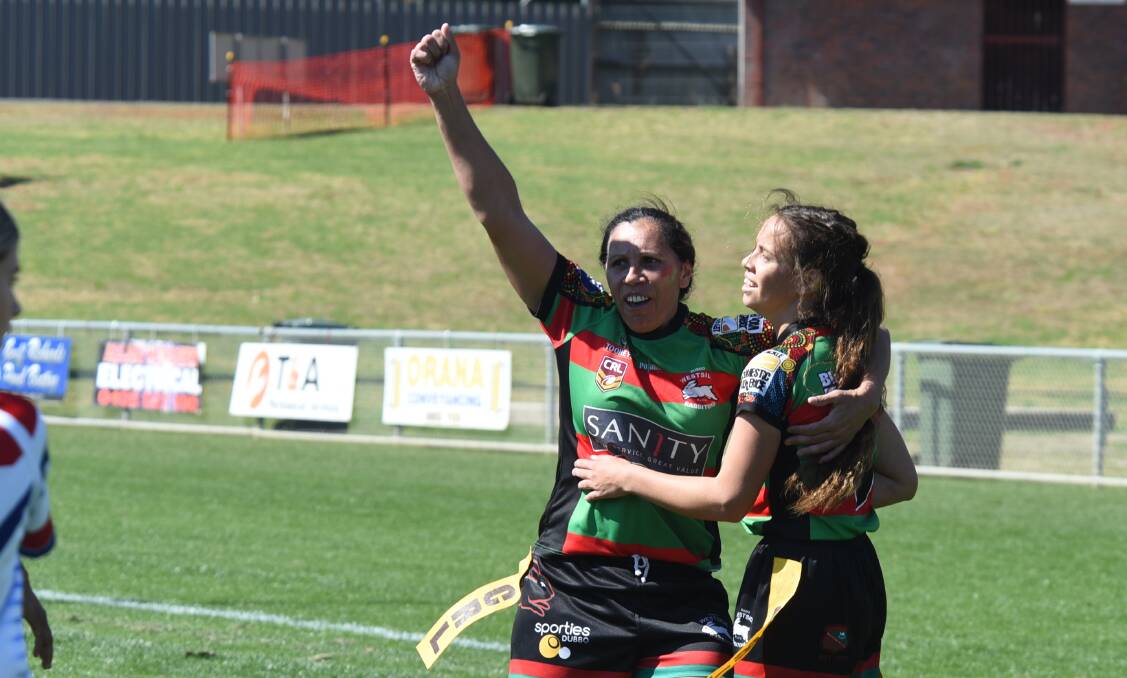 HOW GOOD IS THIS: Rabbitohs players celebrate Madison McGuinness' try during the league tag grand final on Sunday. Photo: AMY McINTYRE