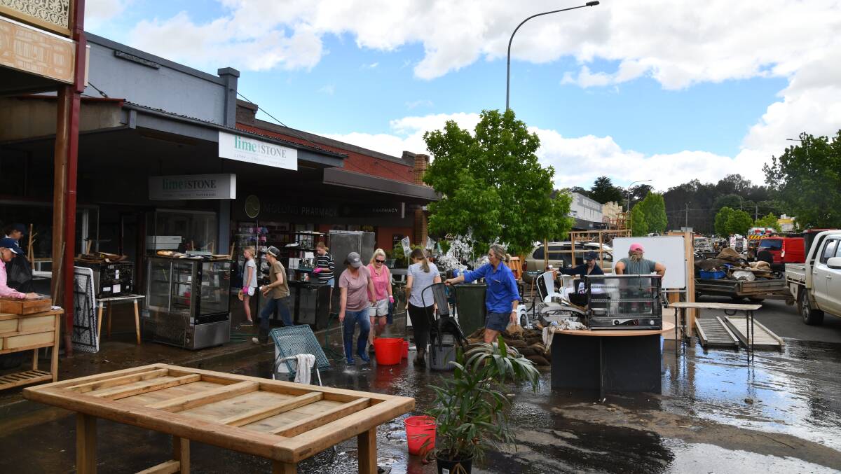 The Molong community comes together to help with the clean-up after flooding hammered the town. Picture by Carla Freedman.