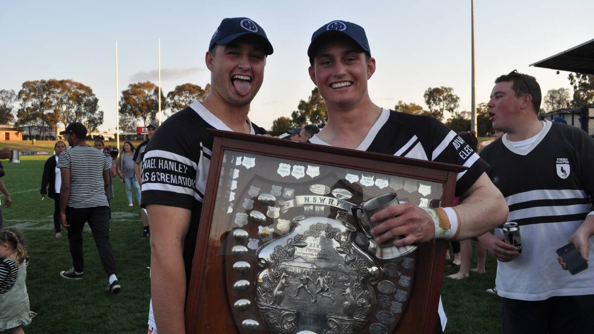 BROTHERLY LOVE: Mitch and Jaiden Burke with the Group 11 premiership trophy. Photo: NICK McGRATH