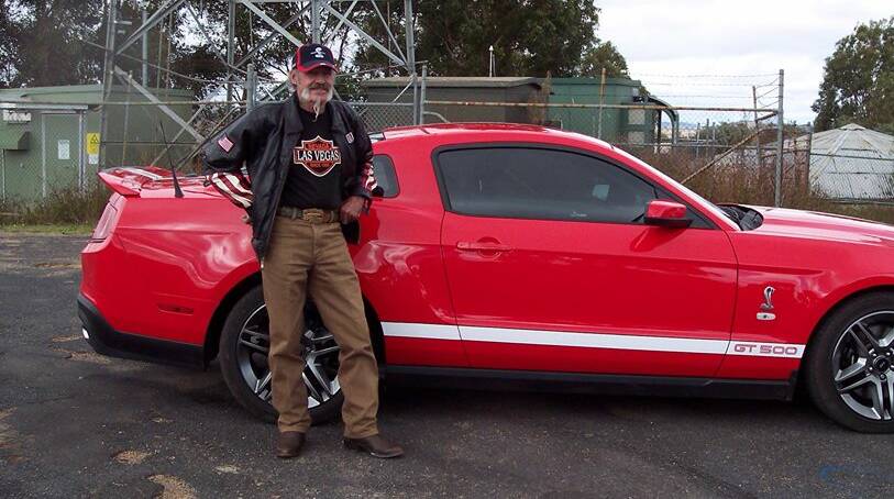 Missing: Robert Dickie with his prized car, a late model red Mustang Shelby. Police are seeking help to find Mr Dickie. Photo: NSW POLICE