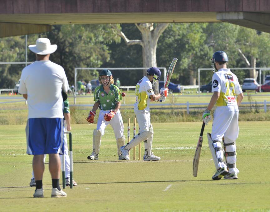 St Johns batsman Joe Yeo faces the long walk back after being bowled out.
