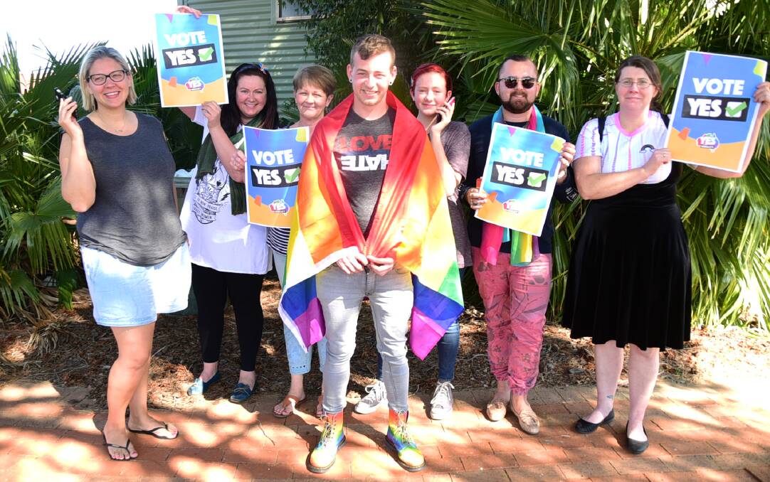 RAINBOW ARMY: Emily Day, Tracy Grant, Suzanne Rockley, Olivia Perarm, Joel Pickering, Sharon O'Reilly were putting in the hours on the phone on Sunday. Photo: PAIGE WILLIAMS