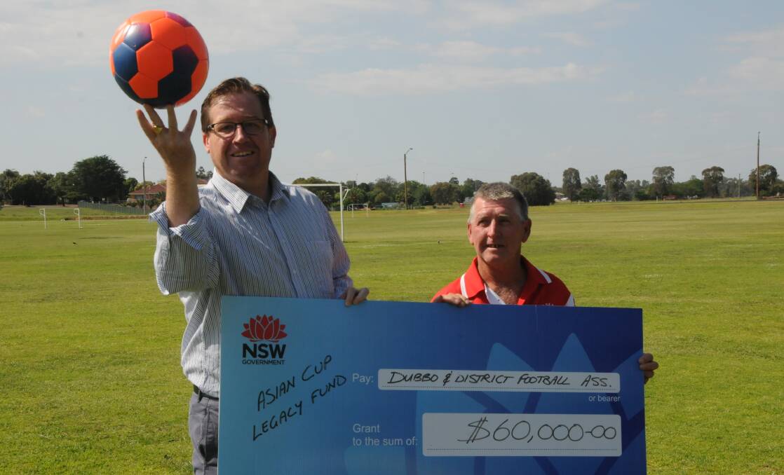 SILKY SKILLS: Dubbo MP Troy Grant with Dubbo District Football Association president Darrell Hines at Lady Cutler on Monday. Photo: BEN WALKER