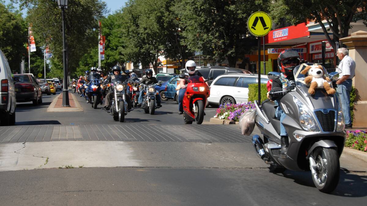 HELPING OUT: Riders head up Macquarie Street in last year's Ulysses Toy Run. The 2017 event will be held on Saturday.