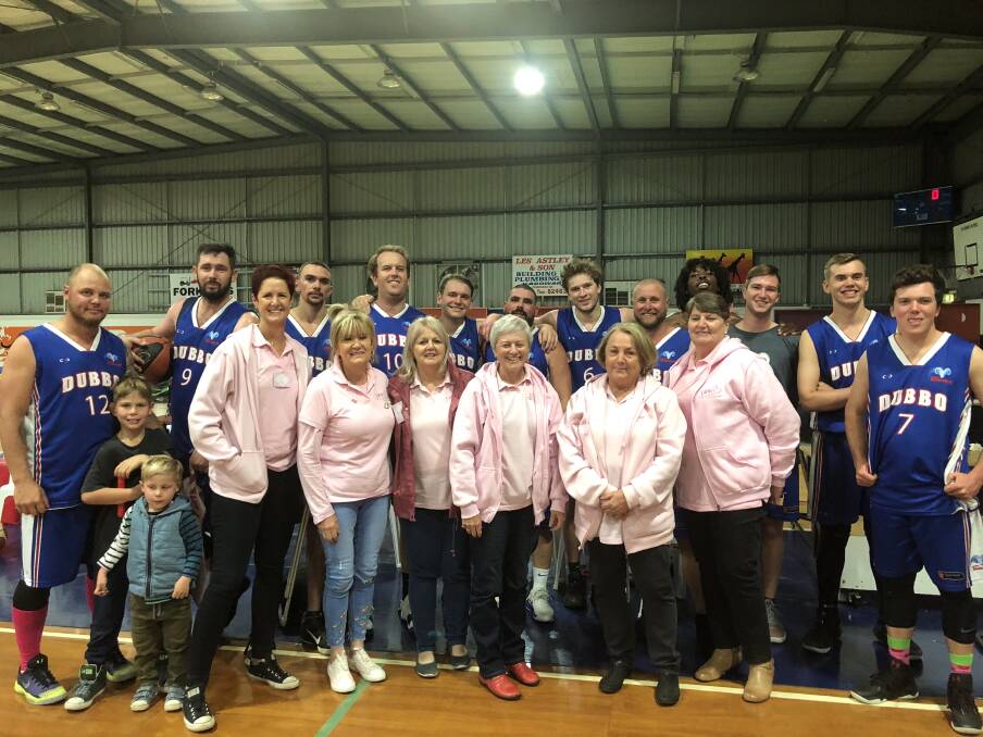 TEAM EFFORT: Dubbo Rams players with members of the Pink Angels after the successful charity night.