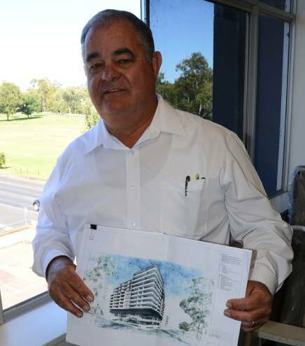 BIG PLANS: John Walkom with a concept drawing of what the 1 Church Street site will look like. Photo: BEN WALKER