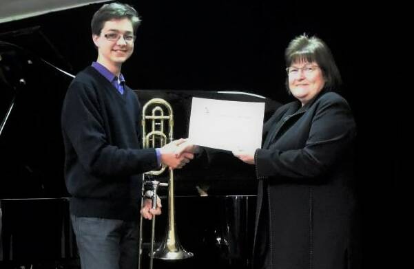 SCHOLAR: Daily Liberal Sales Manager Marilyn Brann presents a $1000 Instrumental Scholarship to Christopher Goud. Photo: TAYLOR DODGE.