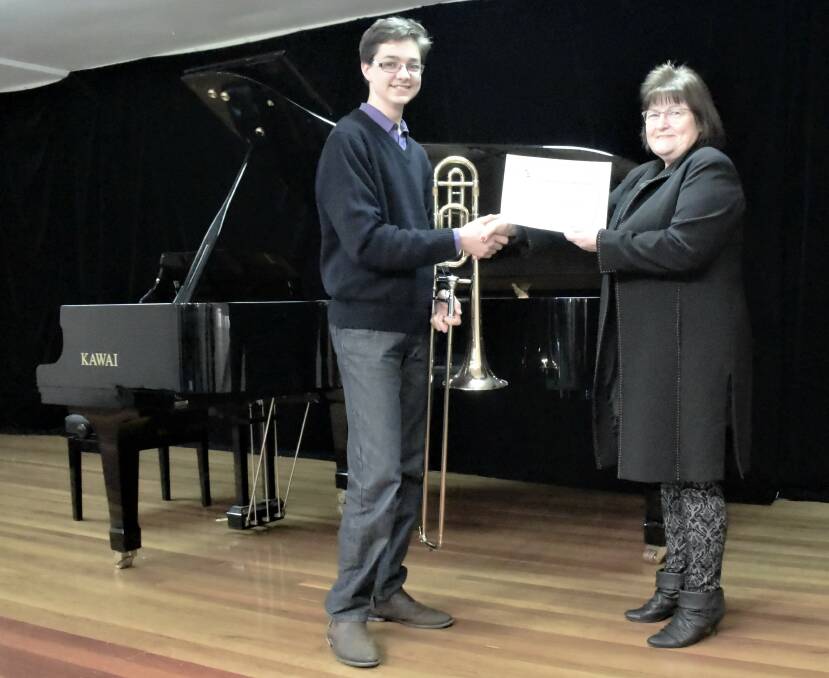 PROUD PERFORMER: Daily Liberal Sales Manager Marilyn Brann presents a $1000 Instrumental Scholarship to trombone player, Christopher Goud. Photo: TAYLOR DODGE.