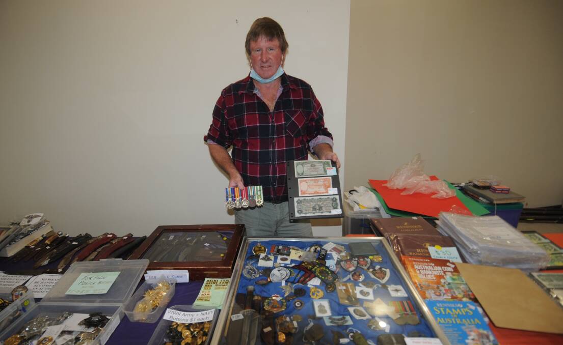 COLLECTORS HEAVEN: Peter Varley with some of his favourite items on sale. Photo: TAYLOR DODGE.