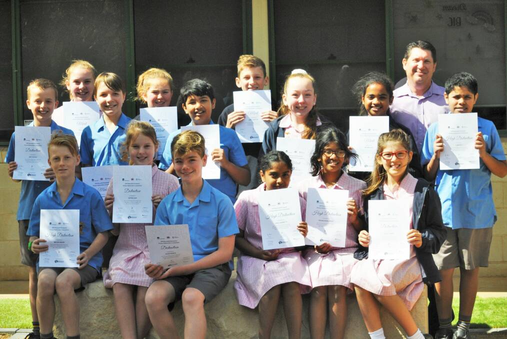 EXCELLENT RESULTS: Dubbo's St John's Primary school principal Anthony O'Leary with students from years five and six. Photo: TAYLOR DODGE.