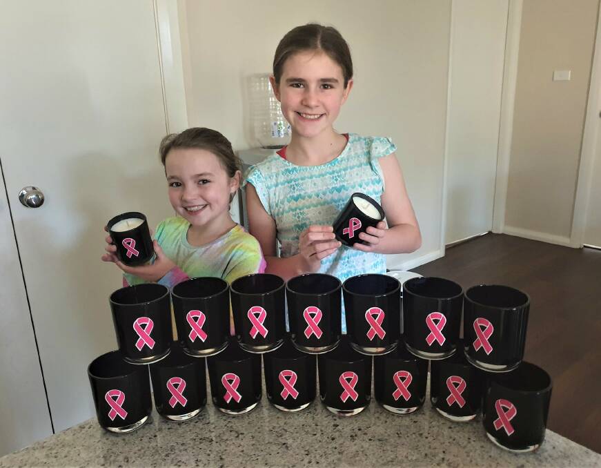 FUNDRAISING: Hallie and Layla Primmer from Dubbo Soy Candles raise funds for the Breast Cancer Foundation. Photo: CONTRIBUTED. 