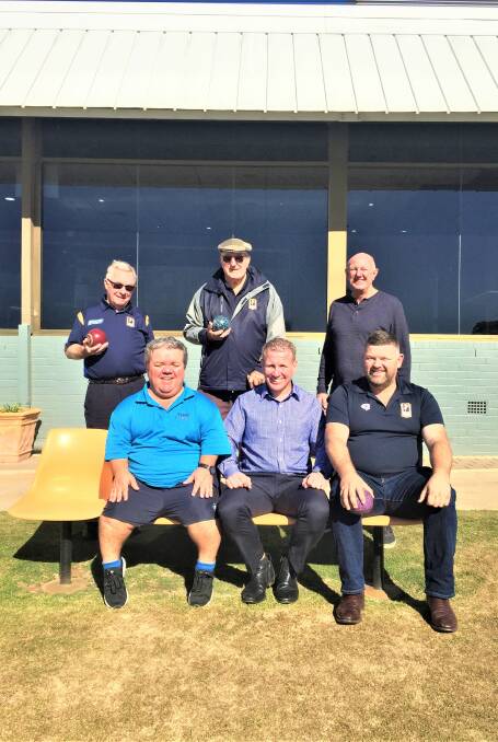 HAPPY: Martin Cook (centre front) and Anthony Brown (front left) with West Dubbo Bowling Club members. PHOTO: TAYLOR DODGE.